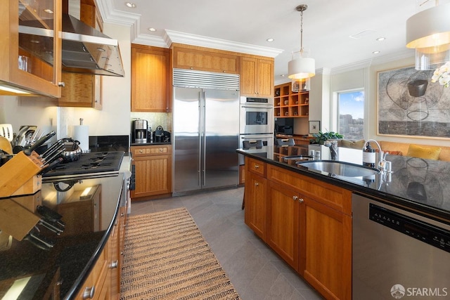 kitchen with brown cabinets, wall chimney range hood, crown molding, and stainless steel appliances