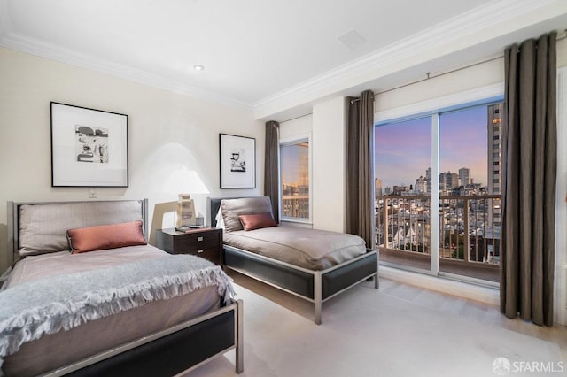 bedroom featuring access to outside, a view of city, ornamental molding, and carpet floors