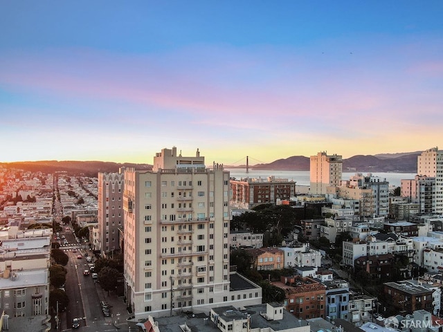 property's view of city with a mountain view