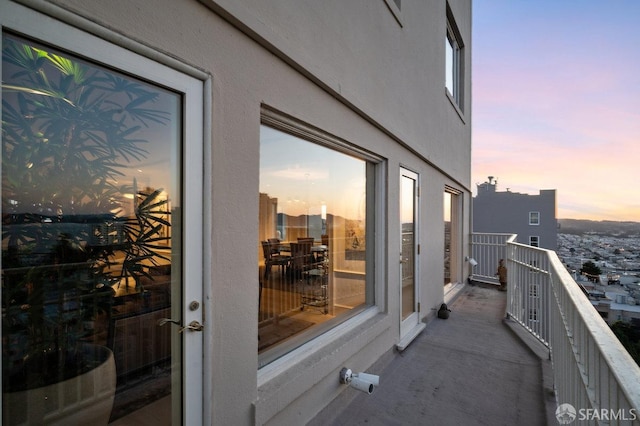 view of balcony at dusk