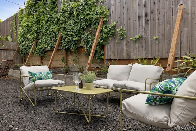 view of patio featuring an outdoor hangout area and a fenced backyard