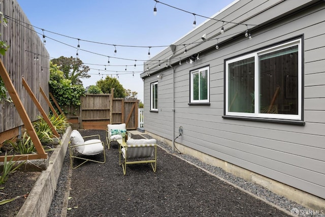 exterior space with fence and a patio area