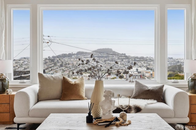 sunroom / solarium featuring a mountain view