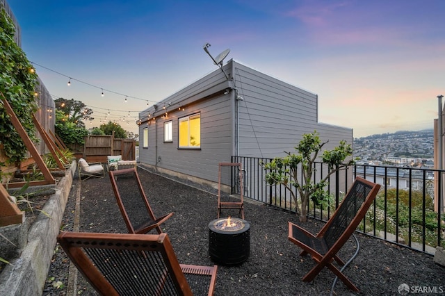exterior space featuring a fenced backyard, a fire pit, and a vegetable garden