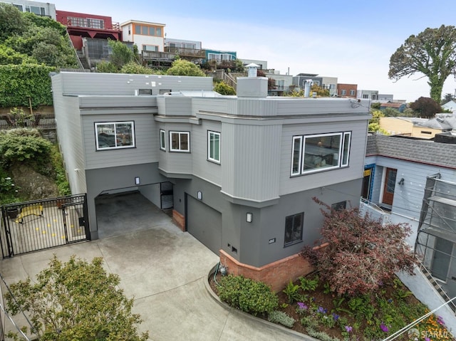 exterior space featuring fence, stucco siding, and an attached garage