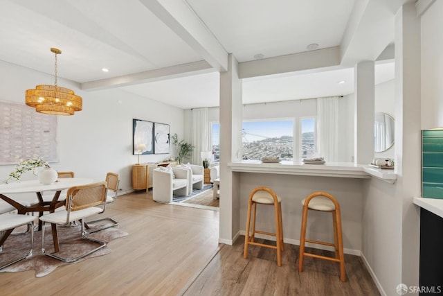 dining room featuring recessed lighting, baseboards, and wood finished floors