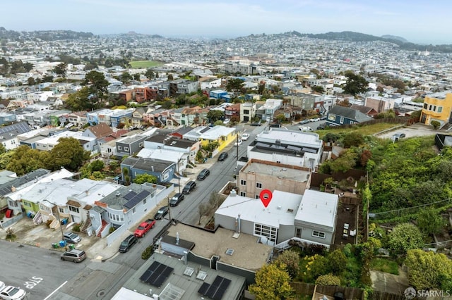 birds eye view of property with a mountain view