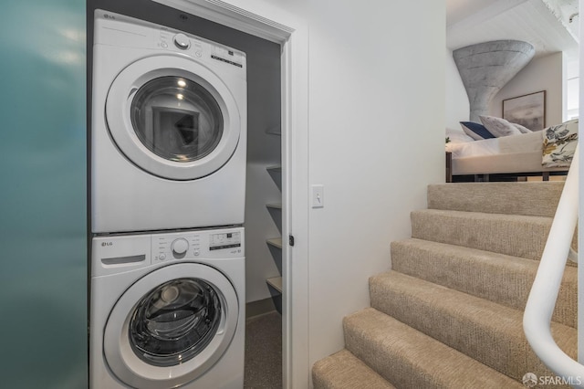 laundry room featuring stacked washer and clothes dryer