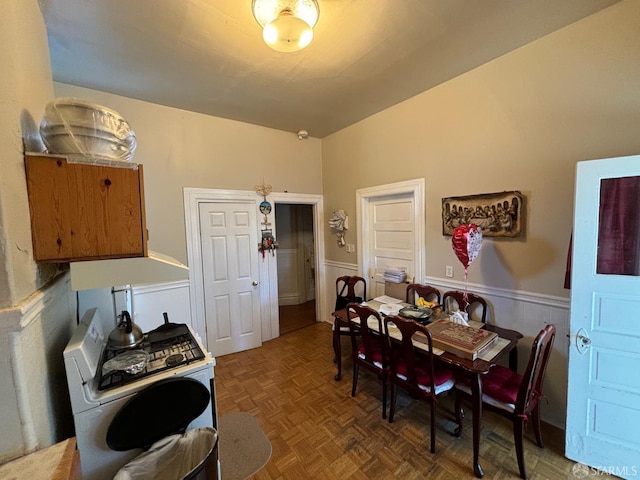 dining area featuring a wainscoted wall