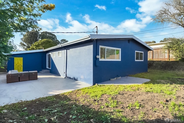 view of home's exterior featuring crawl space, fence, a patio, and stucco siding