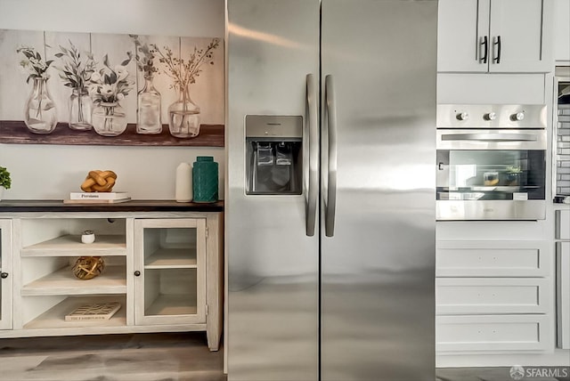 kitchen featuring stainless steel appliances and wood finished floors