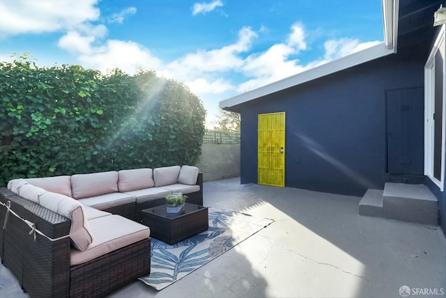 view of patio featuring fence and outdoor lounge area