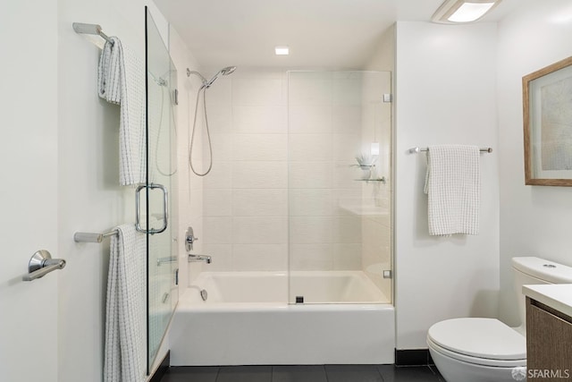 full bathroom featuring vanity, tile patterned floors, toilet, and tub / shower combination