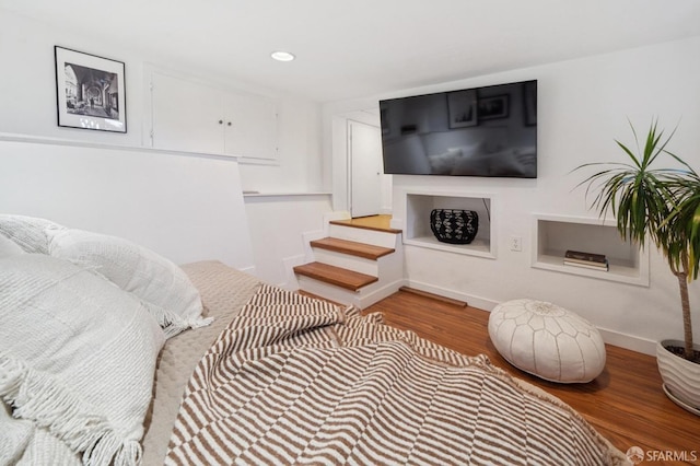 interior space with recessed lighting, baseboards, and wood finished floors