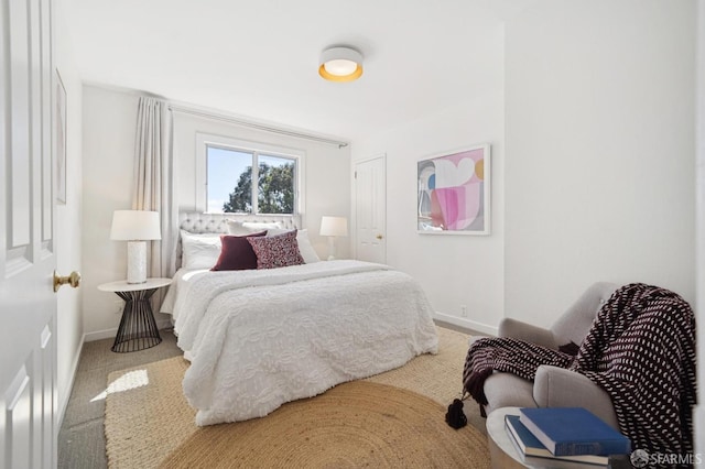 carpeted bedroom with baseboards