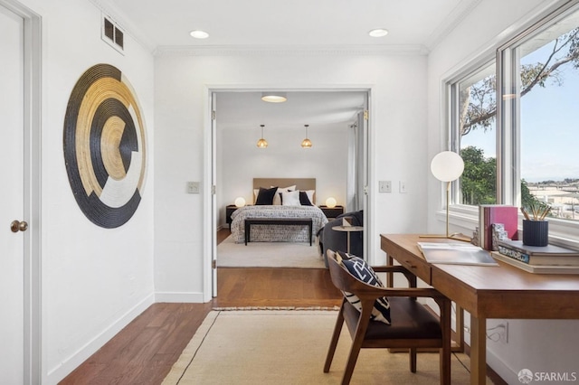 bedroom with visible vents, wood finished floors, recessed lighting, crown molding, and baseboards