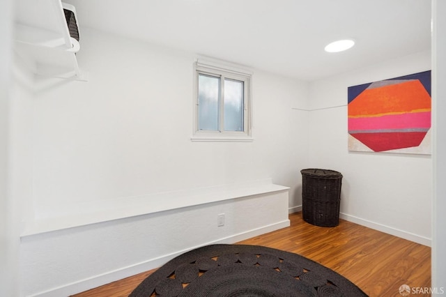 details with wood finished floors and baseboards