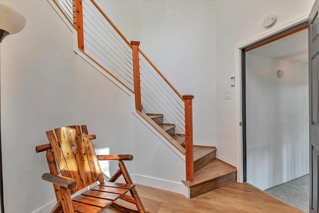 staircase featuring hardwood / wood-style floors