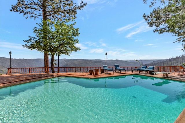 view of pool with a mountain view