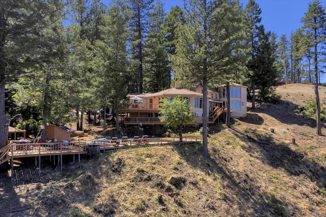 view of yard featuring a wooden deck