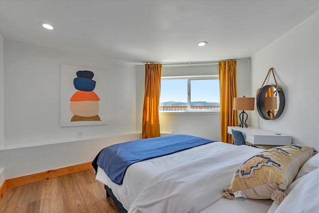 bedroom featuring wood-type flooring