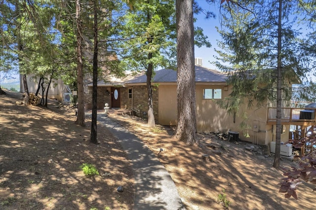 back of house featuring a deck