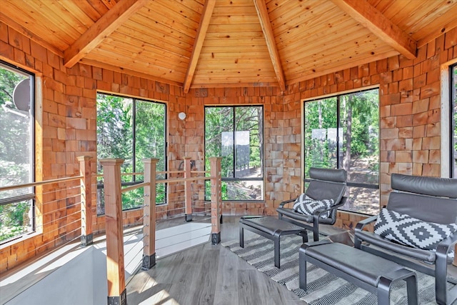 unfurnished sunroom featuring vaulted ceiling with beams and wooden ceiling