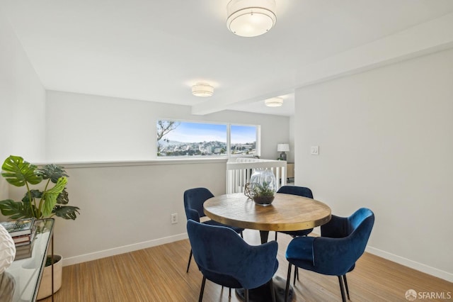 dining area with light hardwood / wood-style flooring