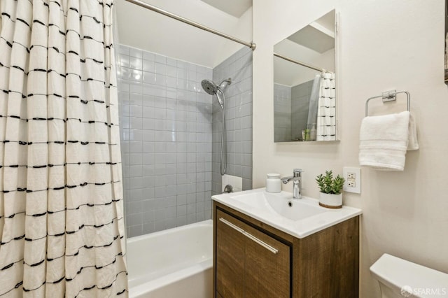 full bathroom with vanity, toilet, and shower / bath combo with shower curtain