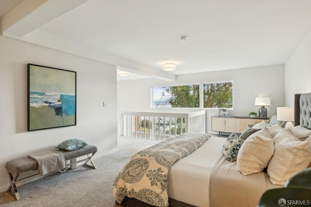 carpeted bedroom featuring beam ceiling