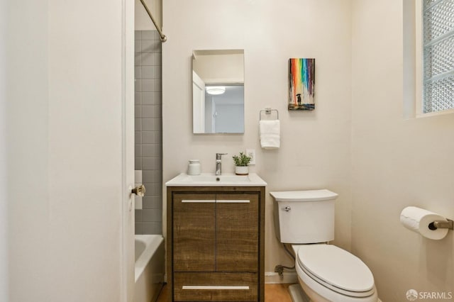 full bathroom featuring vanity, washtub / shower combination, and toilet