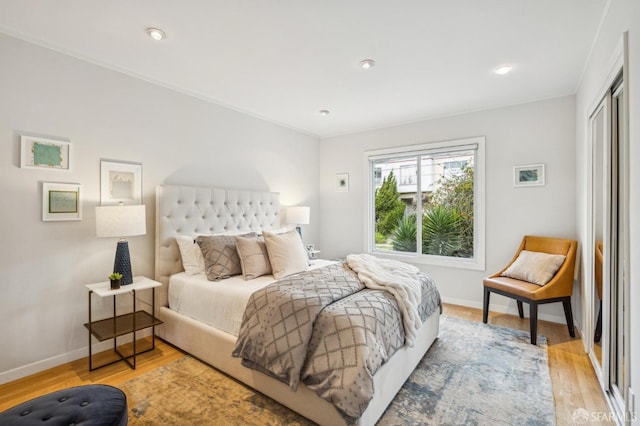 bedroom featuring a closet and light hardwood / wood-style flooring