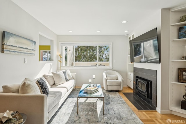 living room with light parquet flooring and built in shelves