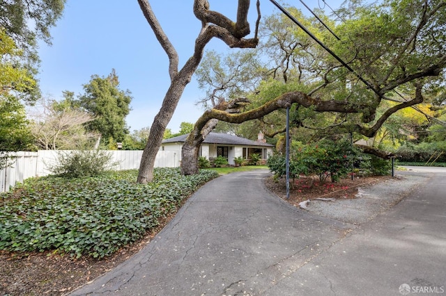 view of front of property featuring fence