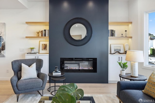 sitting room featuring light hardwood / wood-style floors