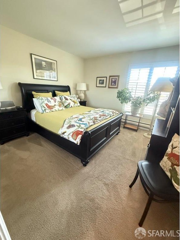 800 N Delaware St Unit 316, San Mateo, CA 94401 - bedroom featuring light colored carpet and a baseboard heating unit