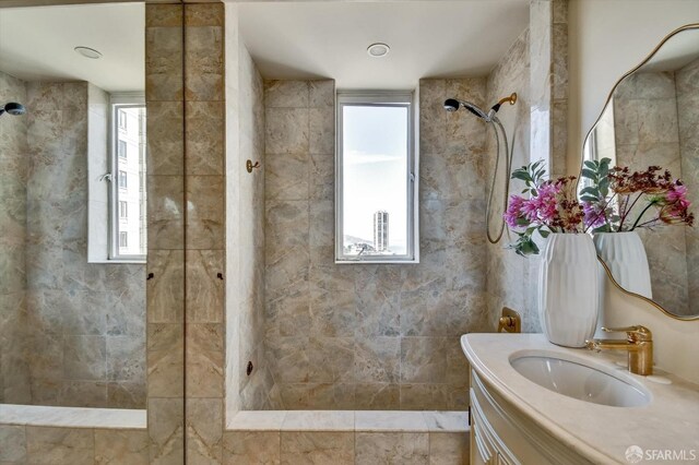 1190 Sacramento St Unit 6, San Francisco, CA 94108 - bathroom featuring a tile shower, vanity, and plenty of natural light