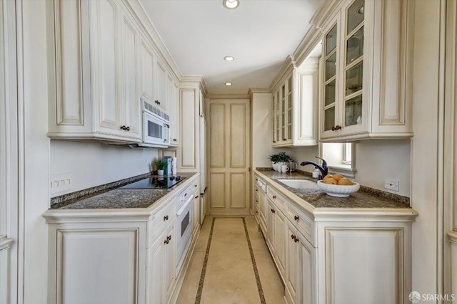 1190 Sacramento St Unit 6, San Francisco, CA 94108 - kitchen with white appliances, glass insert cabinets, recessed lighting, a sink, and dark countertops