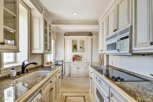 1190 Sacramento St Unit 6, San Francisco, CA 94108 - kitchen with glass insert cabinets, a sink, ornamental molding, white appliances, and light carpet