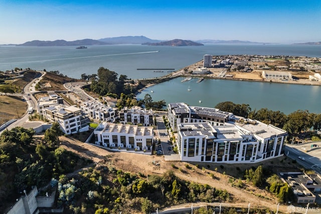 drone / aerial view with a water and mountain view