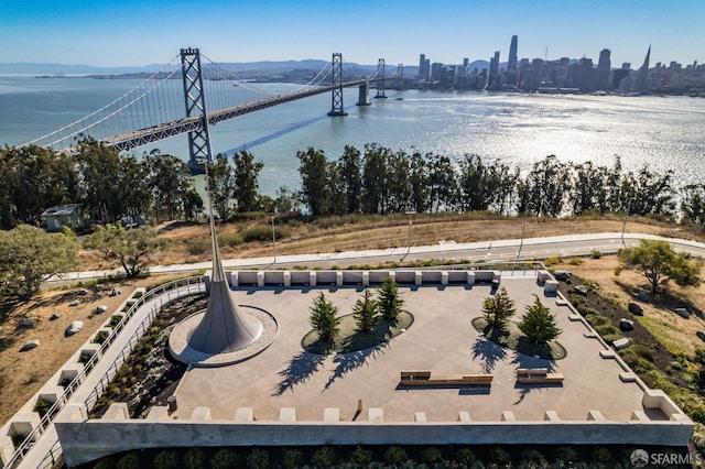 aerial view featuring a city view and a water view
