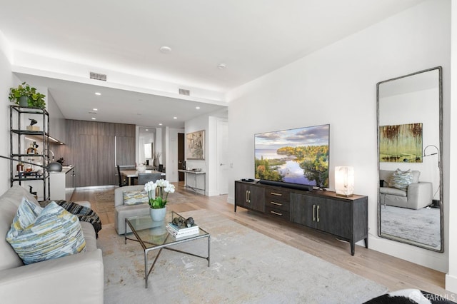 living room with light hardwood / wood-style flooring