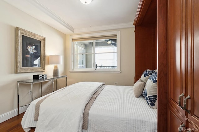 bedroom featuring hardwood / wood-style floors and crown molding