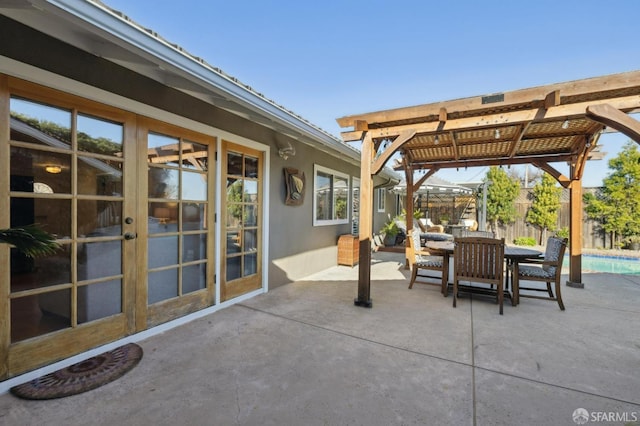 view of patio with french doors and a pergola