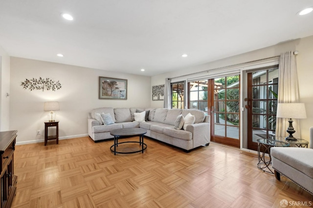 living room with light parquet floors and french doors