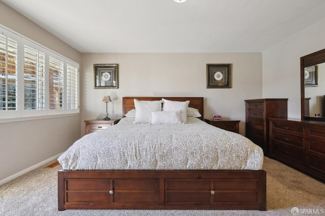 bedroom with light carpet