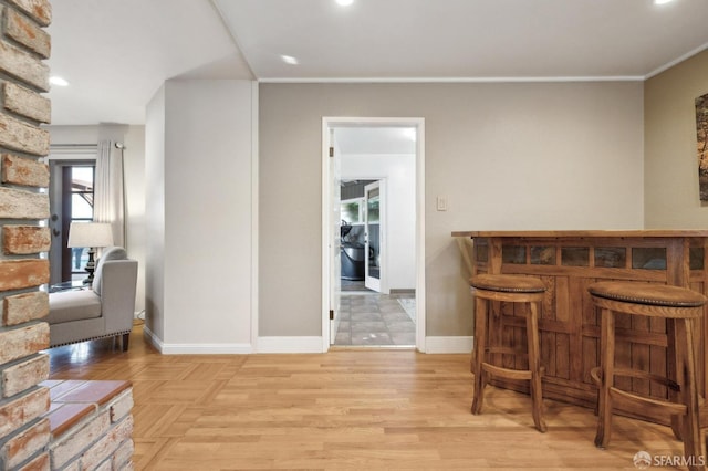 bar featuring light hardwood / wood-style floors