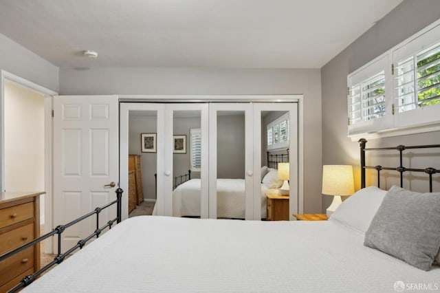 bedroom featuring a closet and french doors