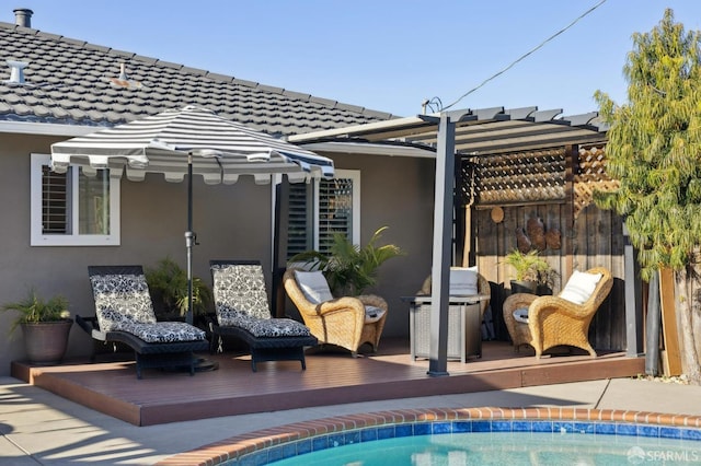 view of patio with a swimming pool side deck and area for grilling