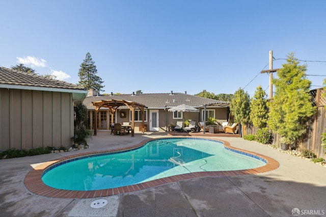 view of swimming pool with a patio area and a pergola